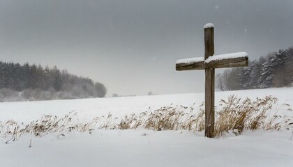 Wooden Cross in a Snowy Meadow in the Winter