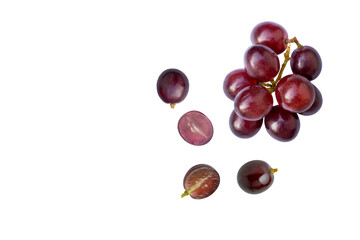 Bunch of red grape and cut half sliced isolated on white background, top view, flat lay.