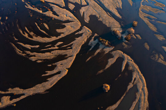 Aerial view of flooded Nerl river with sinuous curves and patterns, Bogolyubovskoe, Vladimir, Russia.