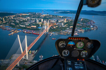 Aerial view of Vladivostok, Golden Horn Bay, and Russki bridge at dusk, Primorsky Krai, Russia.