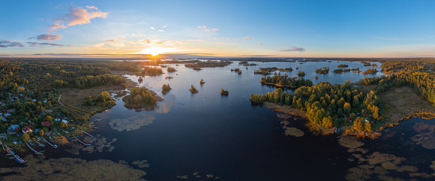 Aerial view of a beautiful sunset over the tranquil countryside village of Larionovskoe, Karelia, Russia.