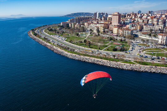 Aerial view of paramotor flying near park in Maltepe district on the Marmara Sea coast of the Asian side of Istanbul, Turkey.