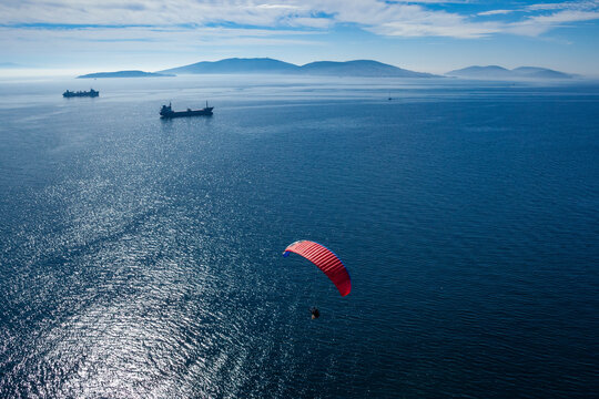 Aerial view of paramotor flying near Princes' Islands over Marmara Sea in Asian side of Istanbul, Turkey.