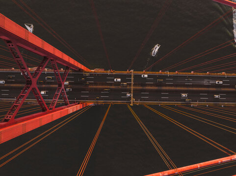 Aerial view of cars crossing the April 25th bridge across the Tagus river in Lisbon, Portugal .