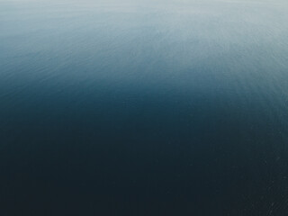 Aerial view of the blue shades of the sea in San Vito Lo Capo, Sicily, Italy.