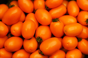 Shop with vegetables. Lots of yellow tomatoes.