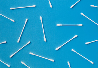 Cotton buds on a blue background