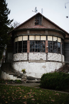 An ancient, round, two-story tower stands tall, exuding timeless charm and history, evoking a sense of mystery and allure