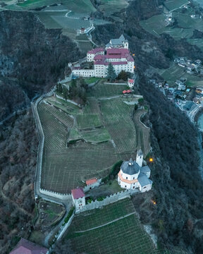 Aerial view of Chiusa town with Sabiona Monastery, Klausen, South Tyrol, Italy.