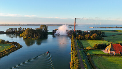 Aerial drone view of an steam pumping station during sunset at Lemmer, The Netherlands.