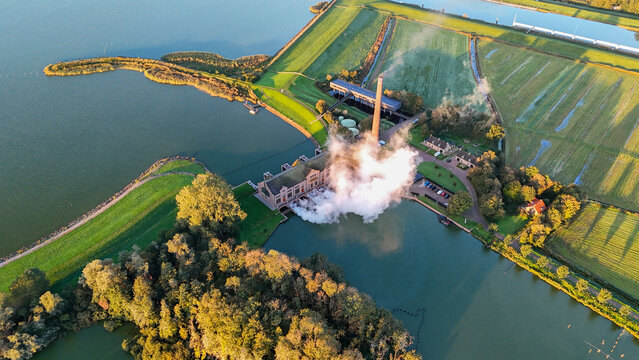 Aerial drone view of an steam pumping station during sunset at Lemmer, The Netherlands.