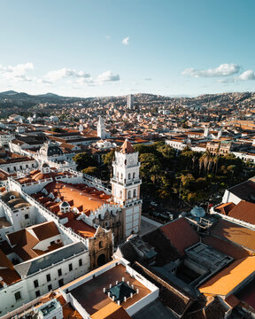 Aerial drone view at sunset of the town of Sucre and its old town in the region of Sucre, Bolivia.