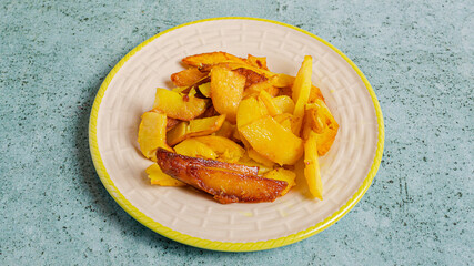 Roasted potatoes plate top view