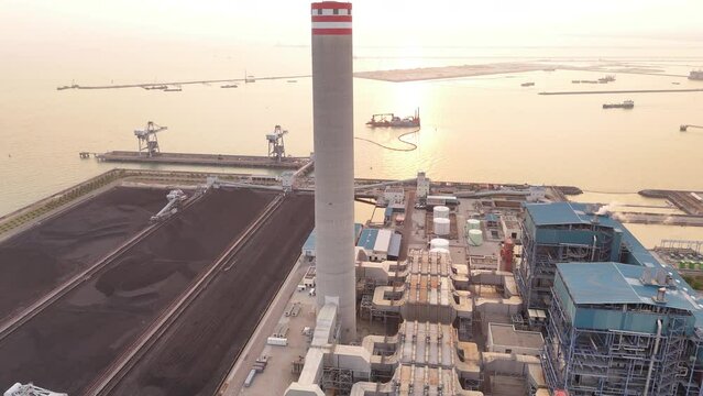 Heavy industrial coal power electricity plant with chimney and pipes, lignite coal product mass ready to be energy for electricity power plant