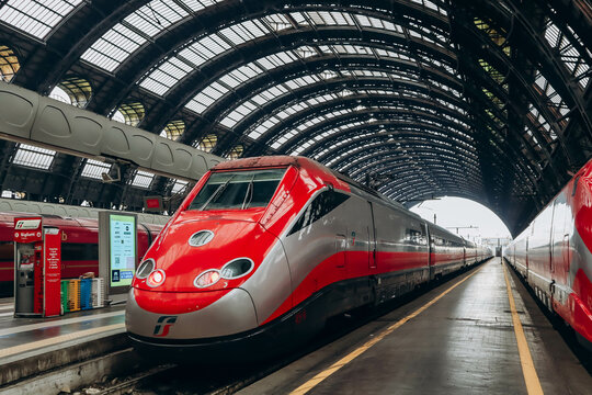 Milan, Italy - 2 January 2024: Two symmetrically situated FrecciaRossa trains at a station in Milan