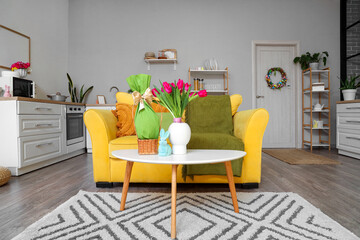 Obraz premium Interior of kitchen decorated for Easter with sofa, door and counters