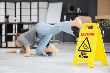 Caution sign of wet floor and fell down businesswoman in office, closeup