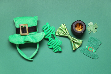 Leprechaun hat with eyeglasses, bow tie and decor on green background. St. Patrick's Day celebration