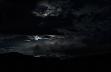 Fototapeta na wymiar A Dark Night Sky with Clouds and the Moon Creative