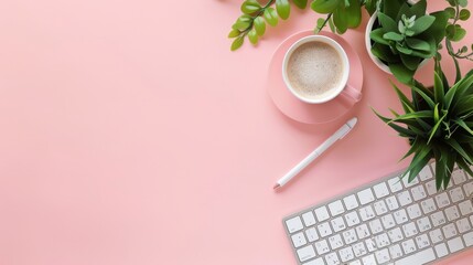 Workspace with keyboard, cup of coffee and plant neatly arranged on pink background