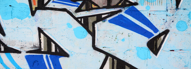 Colorful background of graffiti painting artwork with bright aerosol outlines on wall. Old school...