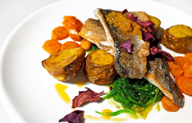 Seabass fillet with potatoes in a restaurant. - 763285477