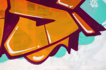 Colorful background of graffiti painting artwork with bright aerosol outlines on wall. Old school...