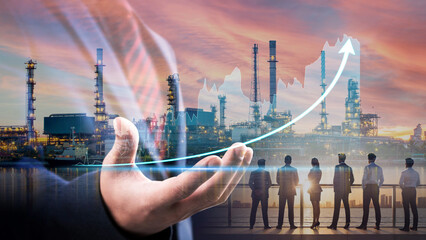 Double exposure of businessman show graph increasing and silhouette of business team with refinery...