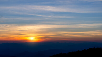 Fototapeta na wymiar Sunset at peak mountain landscape