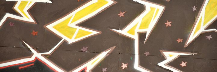 Colorful background of graffiti painting artwork with bright aerosol outlines on wall. Old school...