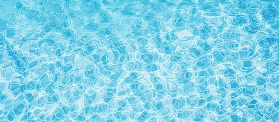 Close up of the liquid azure water in a swimming pool, creating an electric blue pattern that shimmers like a fluid organism in an aqua font - obrazy, fototapety, plakaty