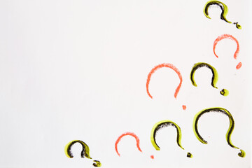 Hand-drawn question mark, boldly marked in black on a white sheet of paper, symbolizing the concept of questioning, uncertainty, and the search for information