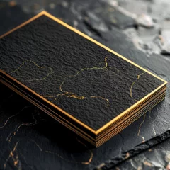 Fotobehang A luxurious high-end business card design featuring gold foil accents on a black matte background © Nisit