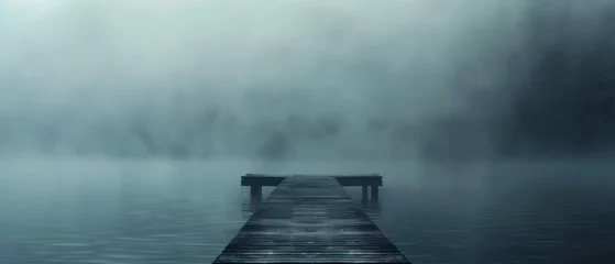  A foggy lake with a wooden pier in the middle © Gasi