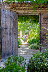 woman walking in doorway villa provence