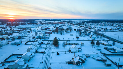 Aerial Winter Sunset Over Snowy Suburban Homes - Fort Wayne