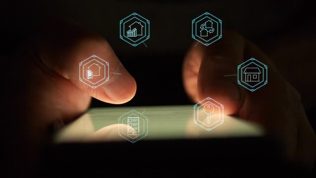 Against the background of the smartphone being used, in the dark there are digital symbols characterizing the real estate market. Cg footage