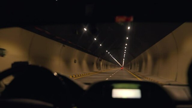 Car driving in a tunnel