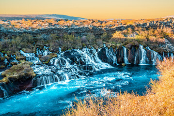 Hraunfossar is a very beautiful Icelandic waterfall, It flows from the lava field and pours into the Hvita river with blue water