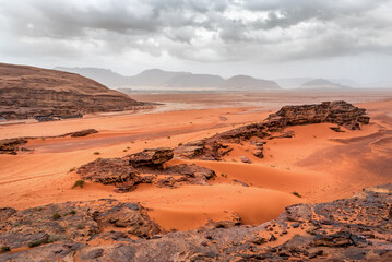 Rainy clouds over red desert Wadi Rum. Martian landscape. Jordan