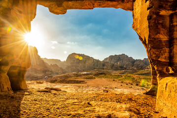 View from the cave on the red rock mountains in Petra. Jordan