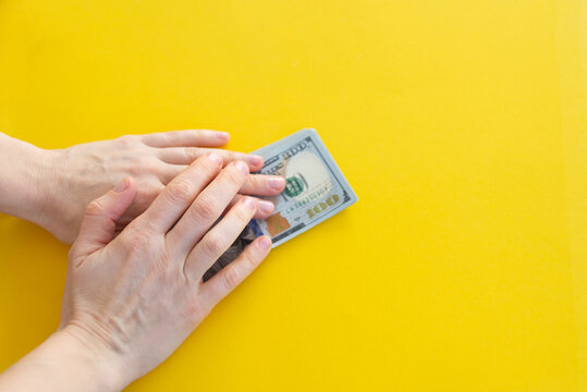 female hands counting banknotes
