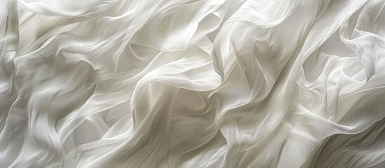 Obraz premium A close up of a grey, smoke patterned transparent material resembling waves on a white cloth. It would make a unique fashion accessory or decor for a special event, made of plastic