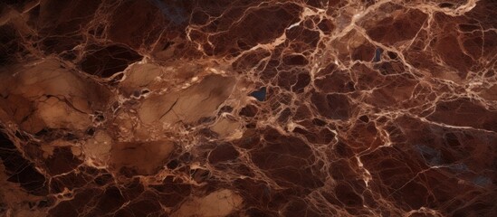 A detailed closeup of a brown marble texture revealing intricate patterns and designs reminiscent...