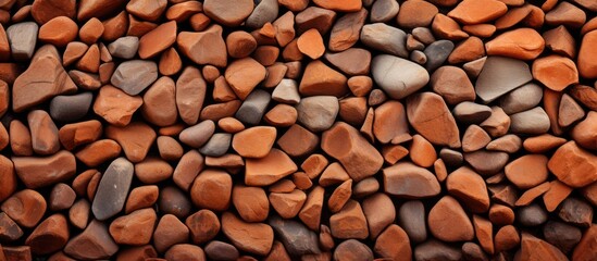 An artistic creation using red rocks stacked to form a unique pattern, showcasing their potential as building material or flooring