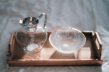 A glass jar and a glass bowl