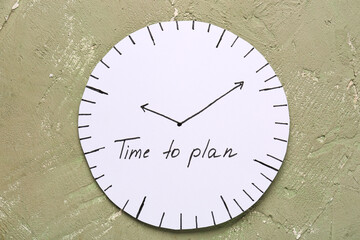 Paper clock with text TIME TO PLAN on grey background. Time management. Top view