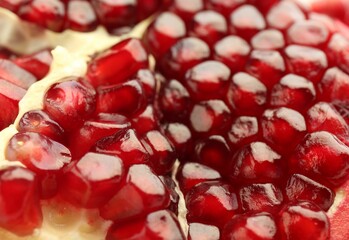 Ripe juicy pomegranate grains as background, closeup