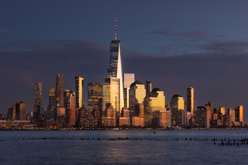 New York City skyline with World Trade Center skyscrapers. Financial District of Lower Manhattan and Hudson River at dusk - 763331897
