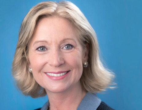 Portrait Of Woman Forty Candid Caucasian Posing In Blue Background